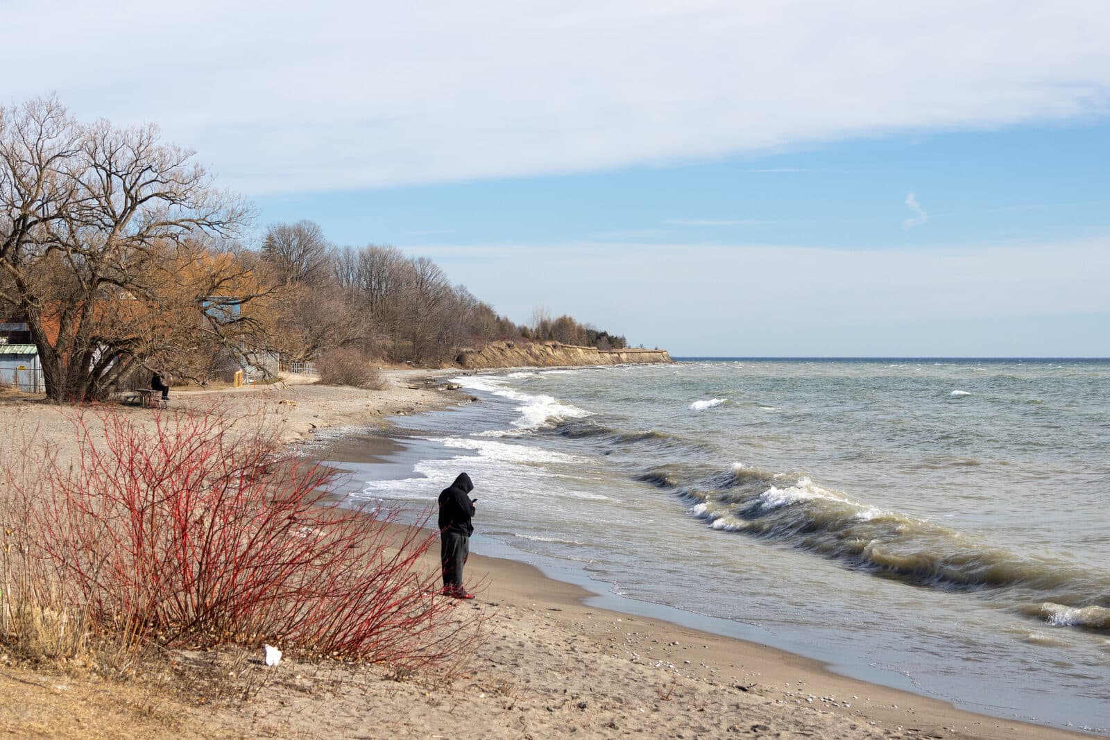 Lake Ontario waves rolling onto the sandy beach at Rotary Sunrise Lake Park on the Whitby waterfront in Durham Region