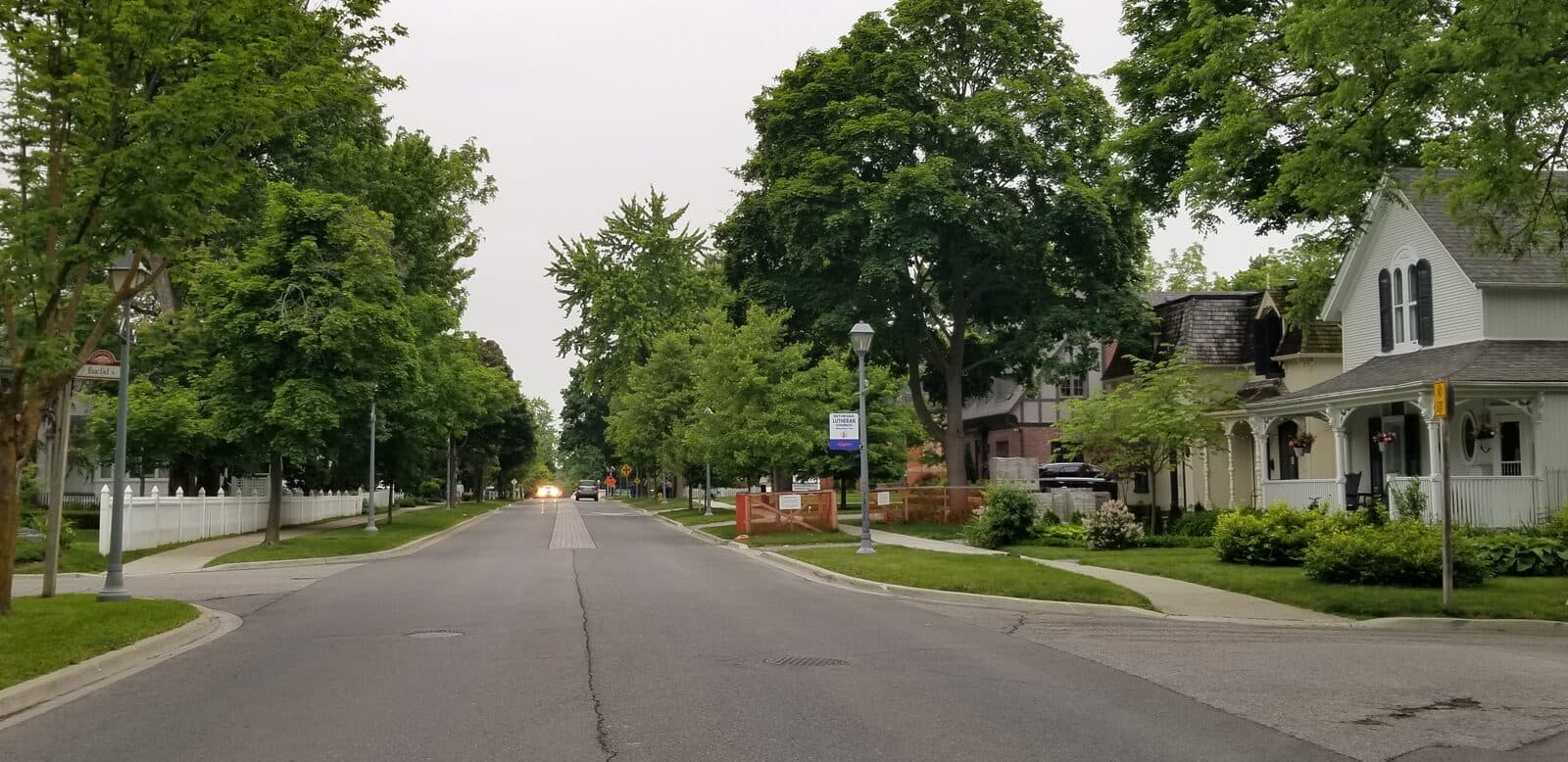 Tree-lined Main Street Unionville in Markham, with Victorian heritage homes and mature trees — a classic York Region streetscape